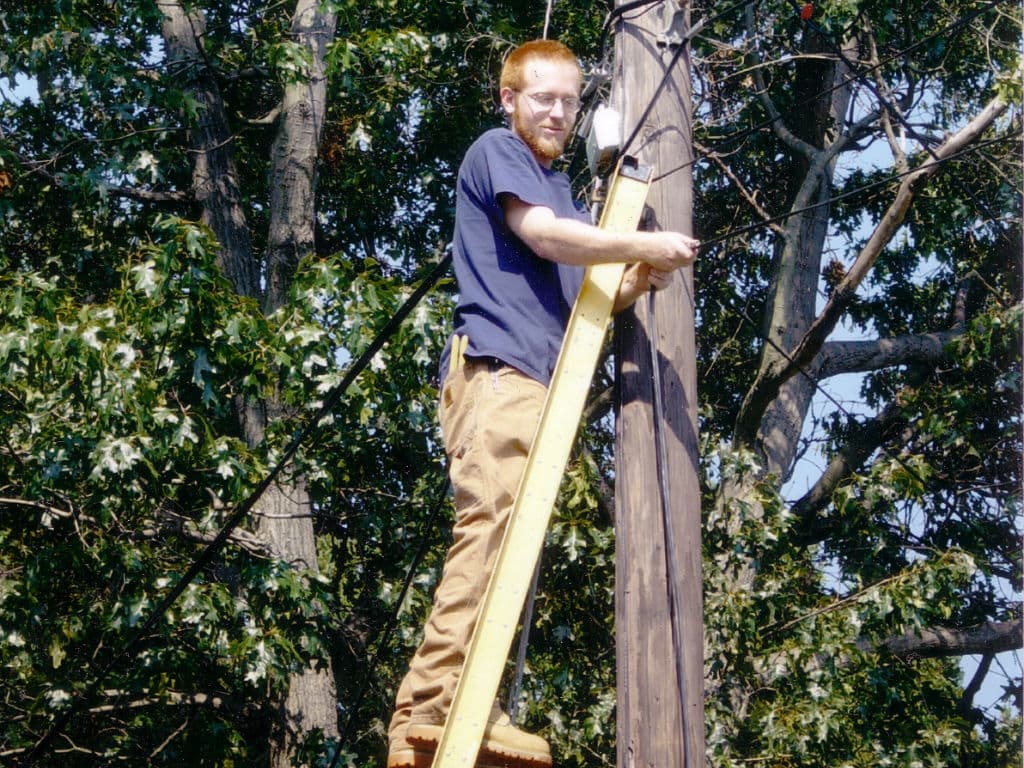 Dave working on a phone pole during electrician apprenticeship